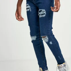 11 Degrees Junior Sustainable Distressed Skinny Jeans – Mid Blue Wash